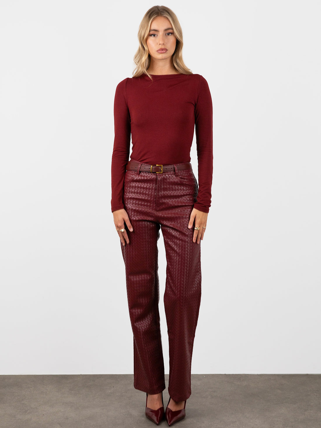 City Outfit Inspiration: Red Wine Woven Leather Trousers for Bold Style