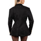 Person wearing a black blazer on a white background