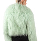 Person wearing a light green Mongolian Green fur  on a white background