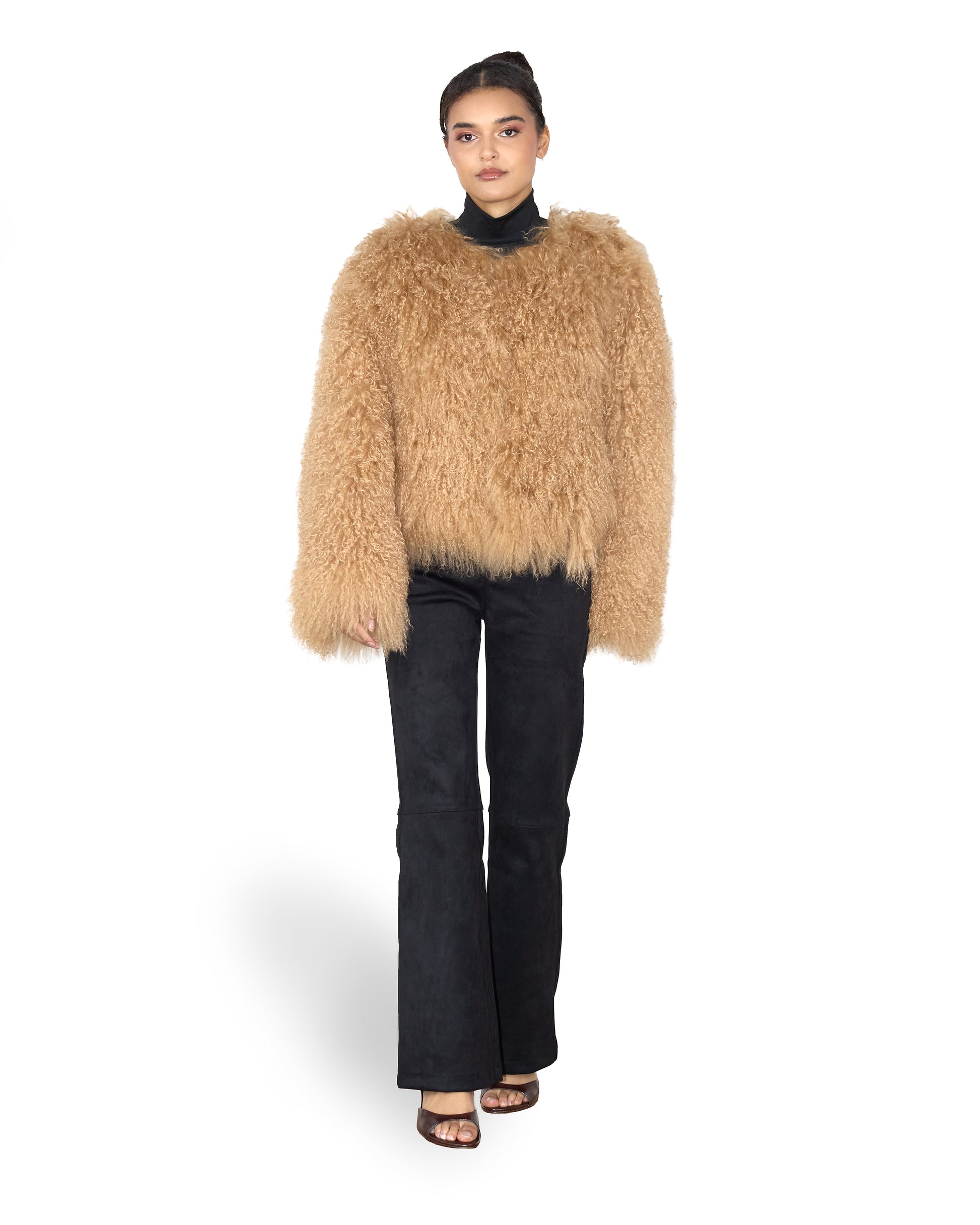 Person wearing a beige Beige Mongolian fur coat on a white background