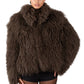 Person wearing a brown Mongolian fur coat on a white background