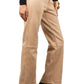 Suede Beige pants worn by a person on a plain background
