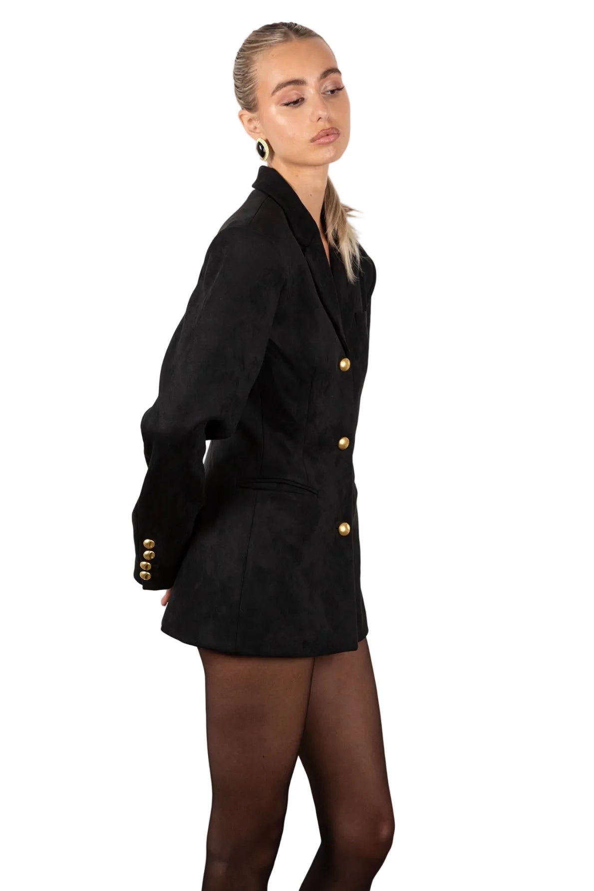Woman wearing a Black suede blazer with gold buttons on a white background