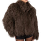 Person wearing a brown Mongolian fur coat  on a white background