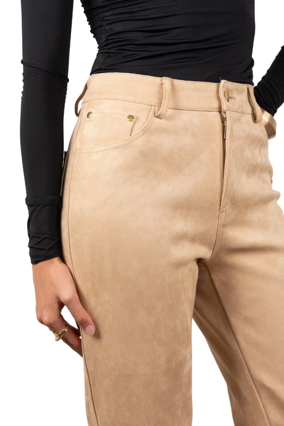 Beige pants worn by a person with a black top on a light gray background